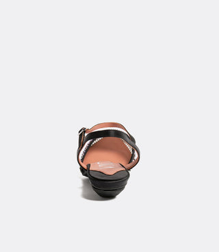 black flat mesh sandal with ankle strap, viewed from the back