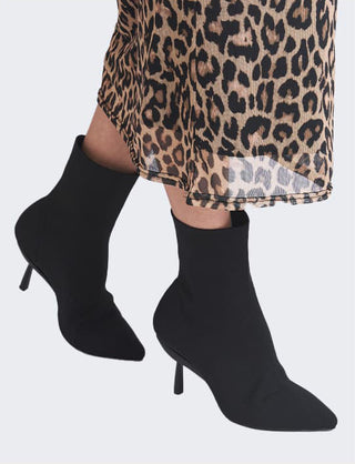 Model wearing knit convertible boots