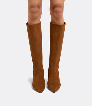 Front view of a model wearing the VICE VERSA Knee High Boots in walnut faux suede