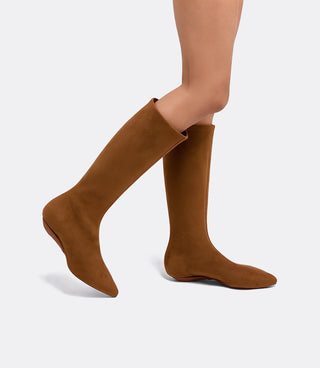 Model walking in the VICE VERSA Knee High Boots in walnut faux suede, side view