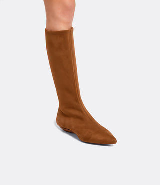 Model wearing the VICE VERSA Knee High Boots in walnut faux suede folded into a flat