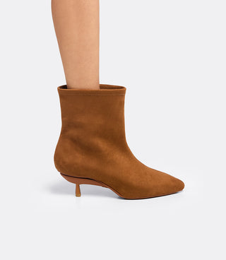 Model wearing the VICE VERSA Bowery Boot in walnut faux suede ankle boot, side view