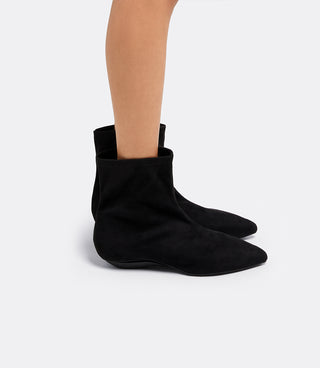 Model wearing the VICE VERSA Bowery Boot in black ankle boots folded into flats