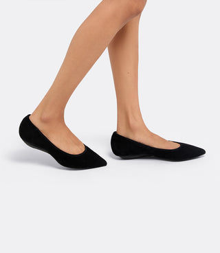 Model wearing the VICE VERSA Ella Pumps in black suede folded into flats