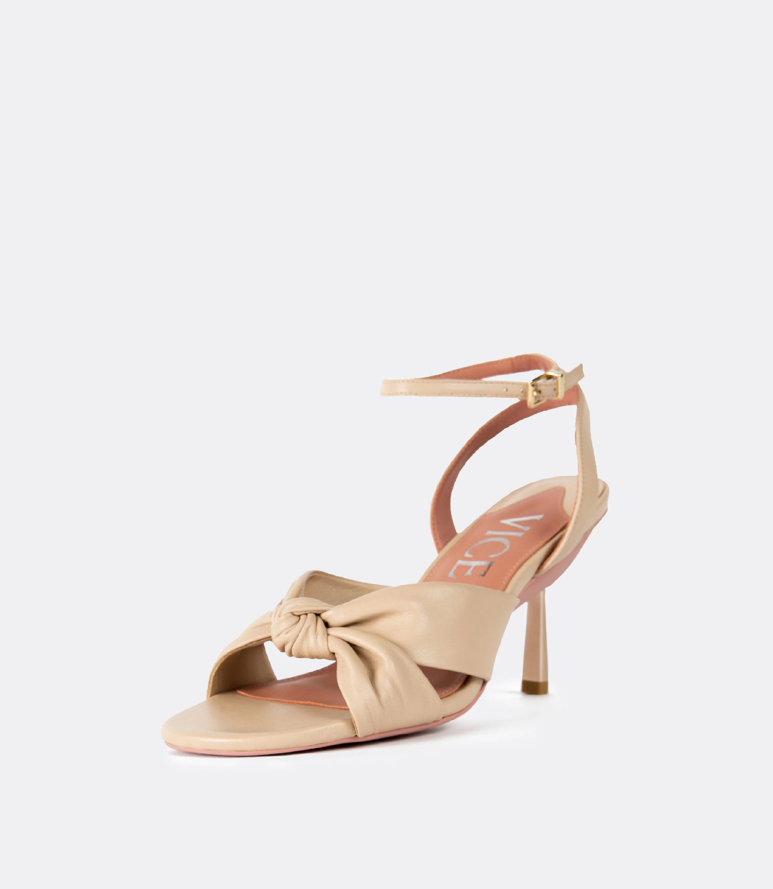 Front view of the beige leather sandal as a heel.