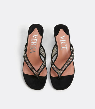 Black sandals with rhinestone details on a white background, featuring the brand 'Vice versa'