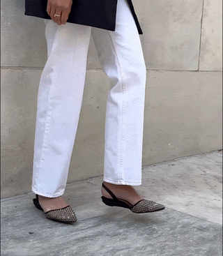 model walking in crystal mesh as a flat shoe