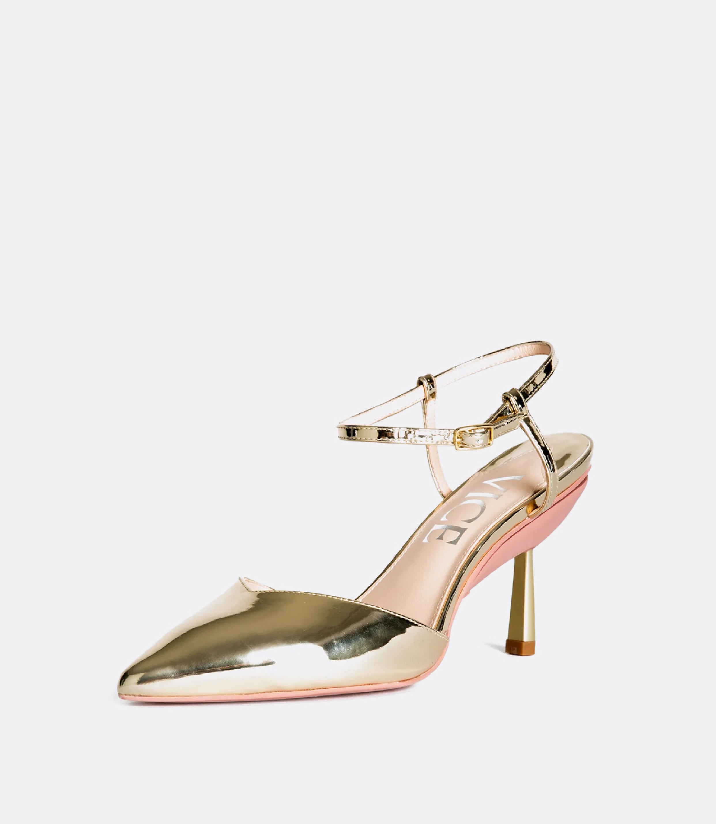 Front view of gold ankle strap pumps.