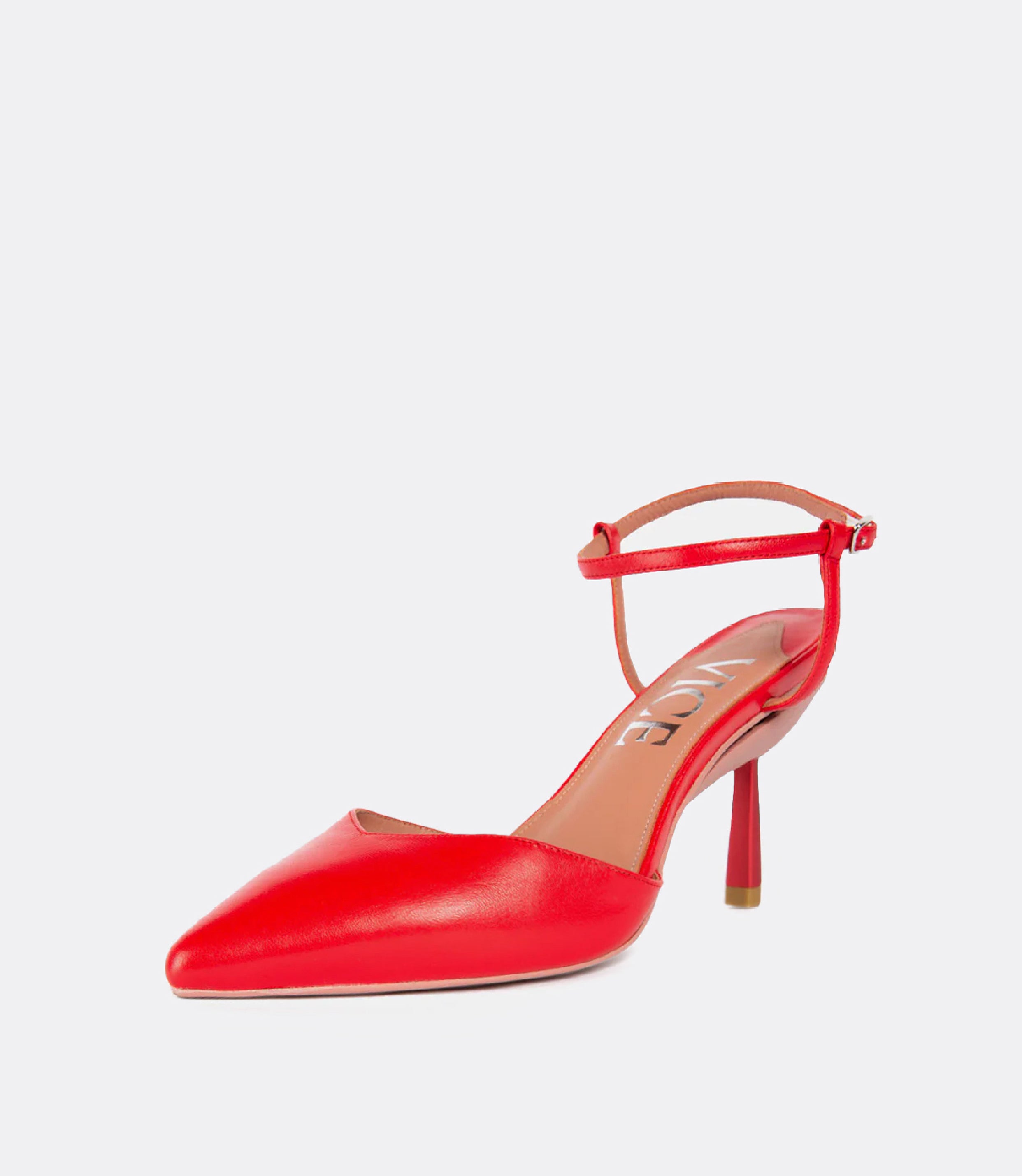 Front view of red ankle strap pumps.