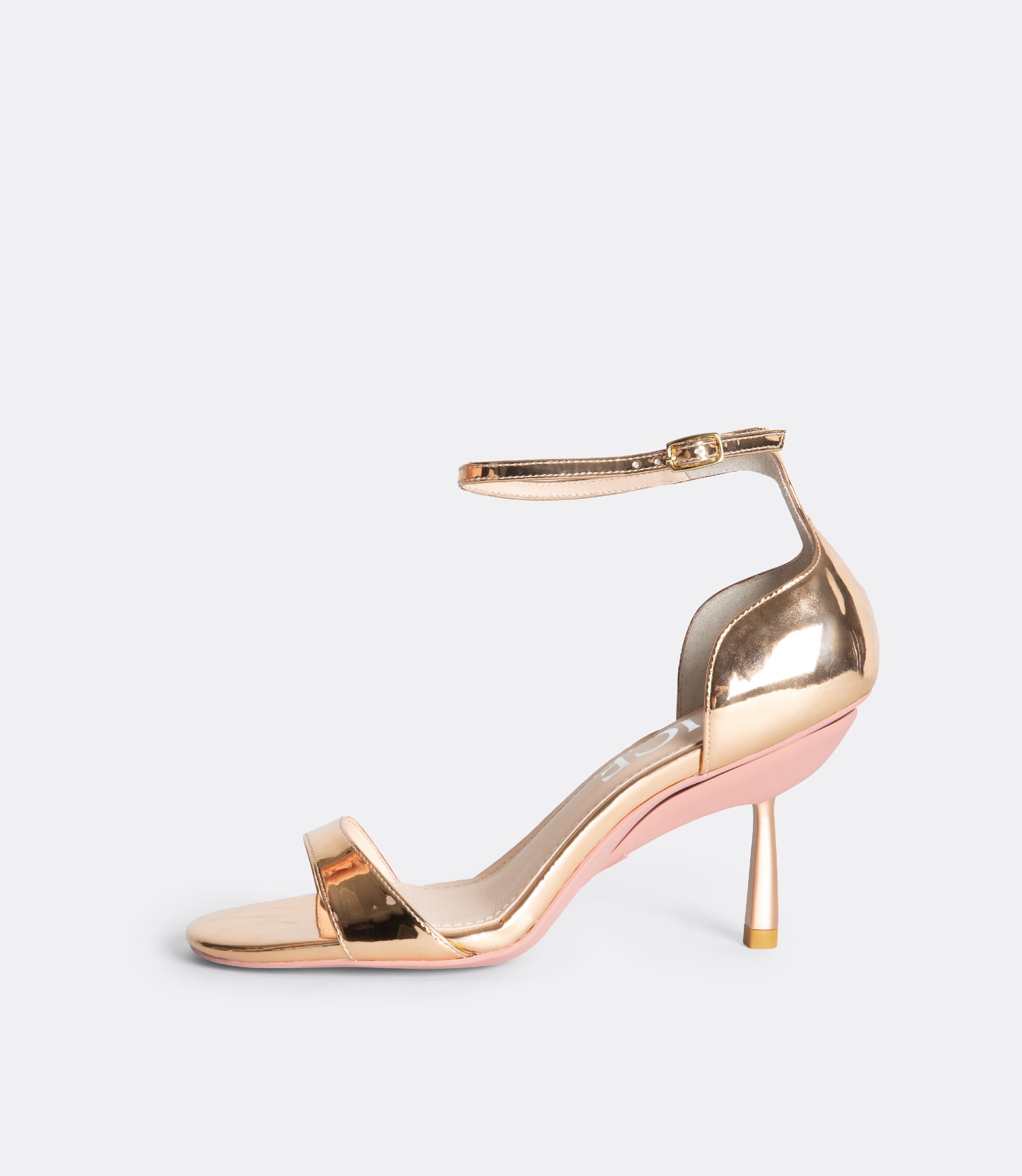Side view of the rose gold editor sandal.