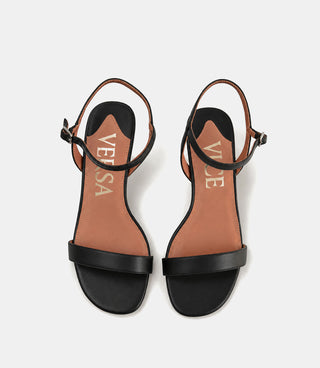 Black sandals with brown insole on a white background