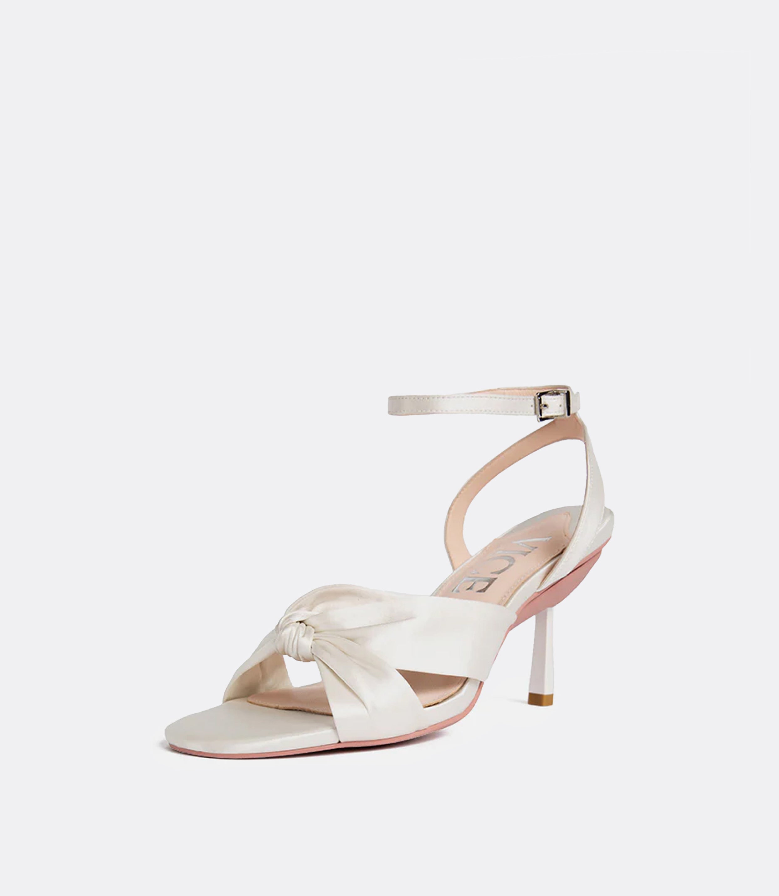 Front view of a white silk sandal as a heel.