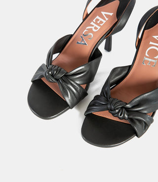close up of black leather sandals