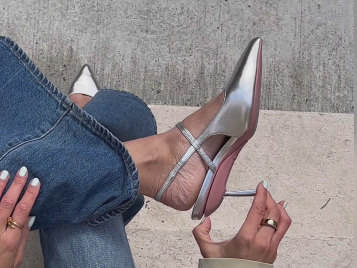 Silver slingbacks folding from a heel to flat