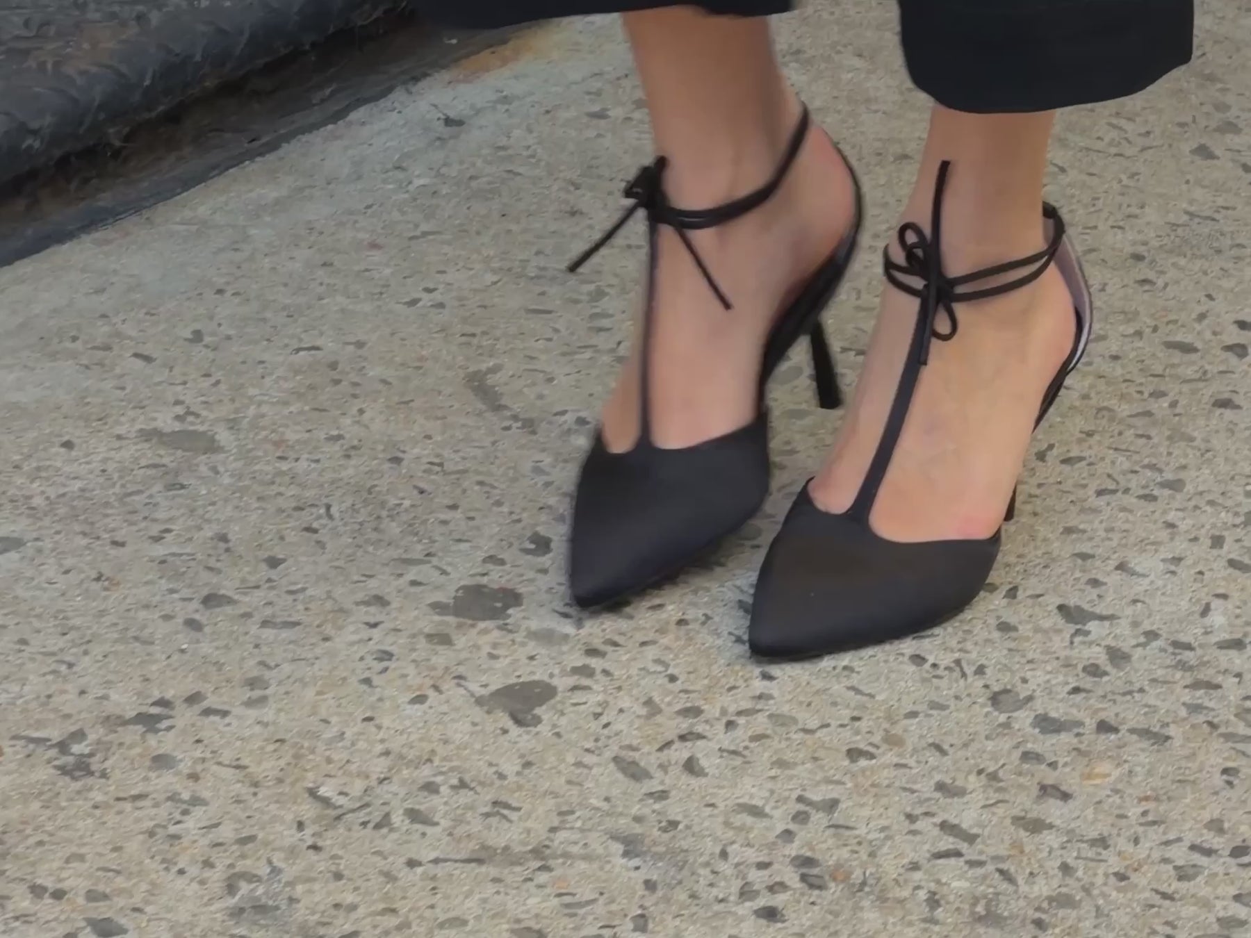 Model walking in T-strap heels 