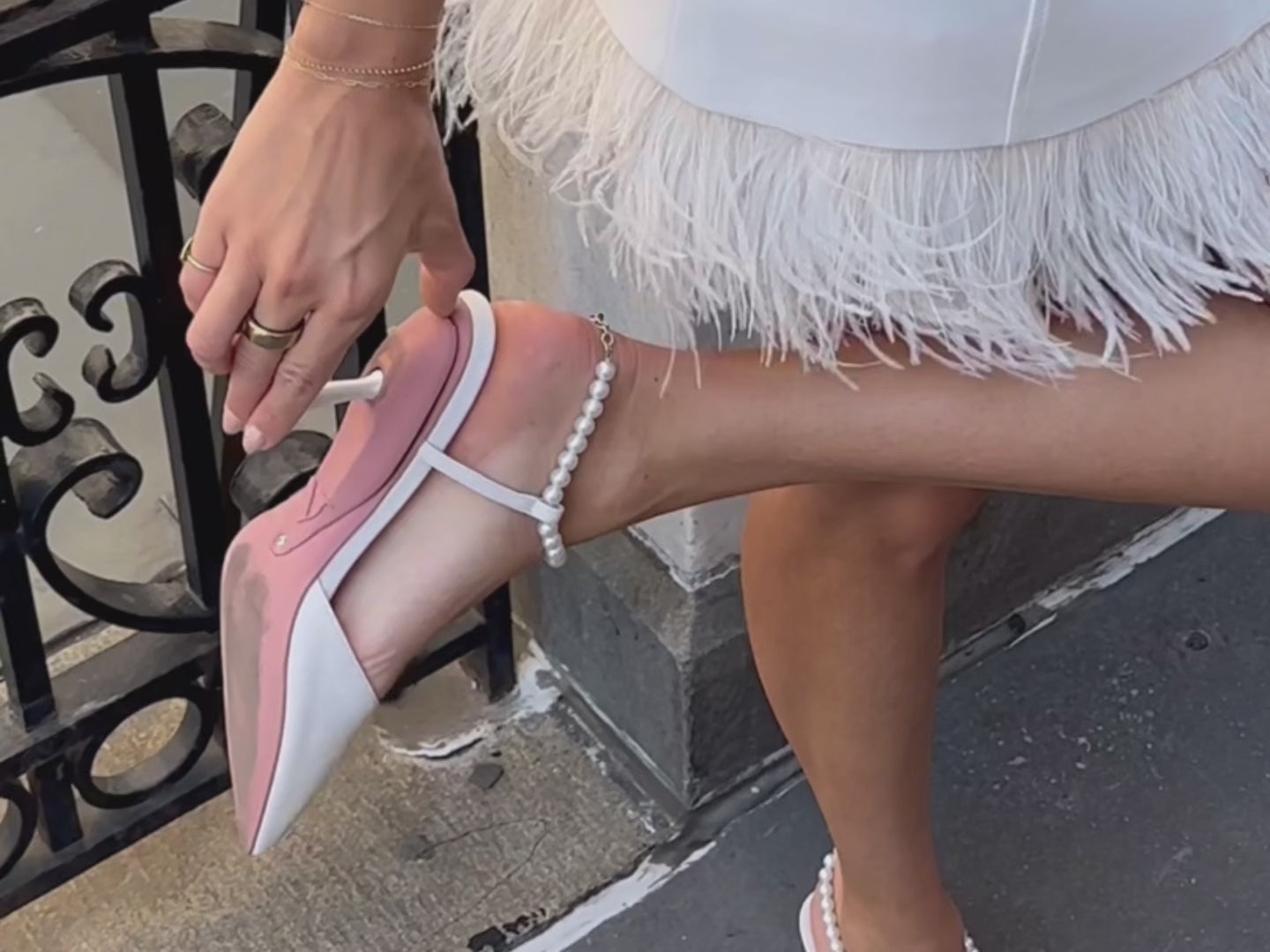 White pearl sandals converting from a heel to a flat