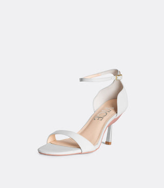 Front view of the white editor sandals.
