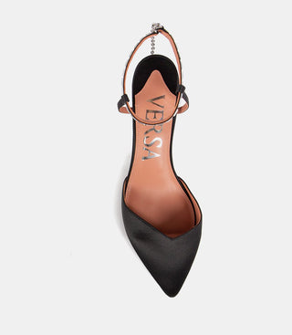 top view of black pointed-toe slingback shoe with VERSA text inside