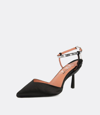 Front view of crystal ankle strap pumps.