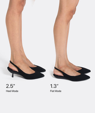 A pair of black slingback pointed-toe flats shown on a model's feet against a light gray background, with text indicating heel height modes: 2.5" Heel Mode and 1.3" Flat Mode.