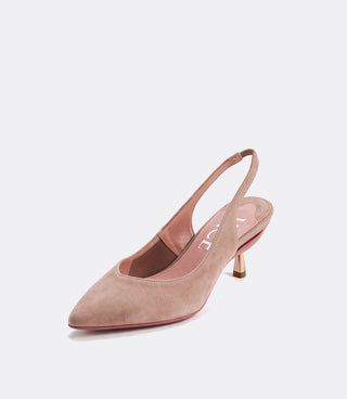 A single pointed-toe slingback pump in dusty blush pink suede, featuring a slim metallic gold kitten heel and a pink insole with white lettering, set against a clean light gray background.