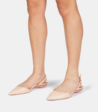 model in flat beige heels