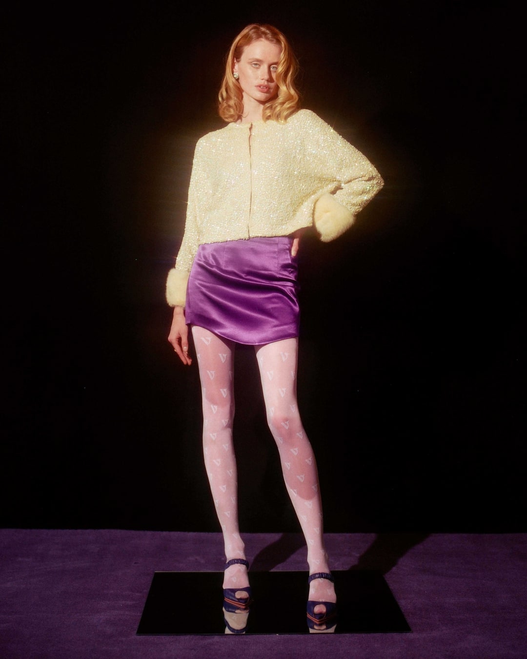 model wearing tights and standing